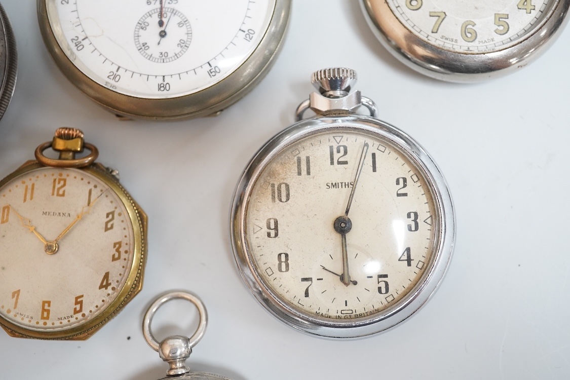 A late 1930's base metal cased Air Ministry spilt second stop watch, case diameter 60mm, together with a Swiss 935 standard open faced pocket watch, one other small white metal pocket watch and three base metal pocket wa